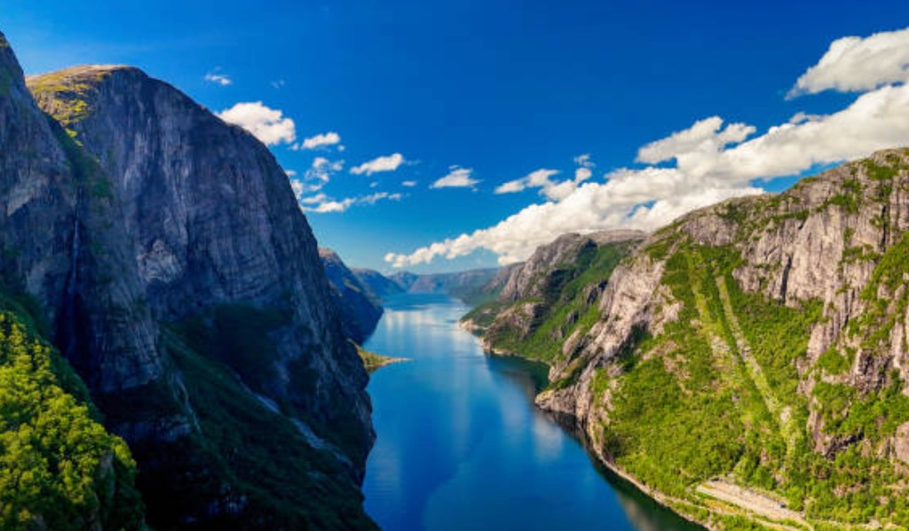 Lysefjord in southwest Norway with steep cliff walls and deep blue water seen from the fjord